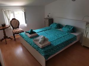 Postel nebo postele na pokoji v ubytování Apartments Oskar