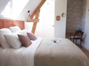 Posteľ alebo postele v izbe v ubytovaní Maison Chemin, chambres d'hôtes à Amboise