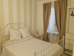 Кровать или кровати в номере La Cameretta
