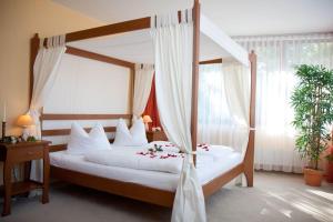Postel nebo postele na pokoji v ubytování Hotel Balneolum Superior
