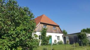 a large white house with a brown roof at Ruheoase an der Seenplatte Objekt-ID 12030-3 