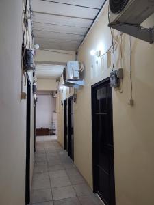 an empty hallway with a door in a room at SPOT ON 91402 Home'59 Tegal Danas in Bekasi