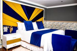 Uma cama ou camas num quarto em Xilumani Hotel
