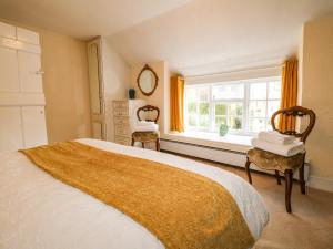 Voodi või voodid majutusasutuse Arch Cottage toas