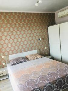 Кровать или кровати в номере Holiday Apartments EcoStar1