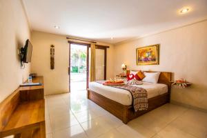 Postel nebo postele na pokoji v ubytování Asri Sari Villa Ubud