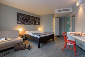 Postel nebo postele na pokoji v ubytování ibis Hamburg Alsterring
