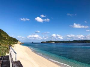 a view of a beach with the ocean at Housei in Zamami