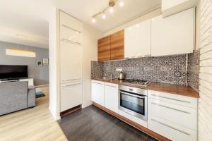Kuchnia lub aneks kuchenny w obiekcie Shum Jeziora Apartament nr 7