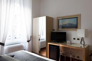 TV a/nebo společenská místnost v ubytování Rex Lifestyle Hotel