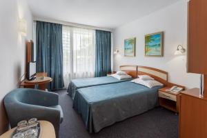 Postel nebo postele na pokoji v ubytování Hotel Sirena Saturn All Inclusive