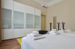 Llit o llits en una habitació de Contempora Apartments - Crocetta - Don Giovanni