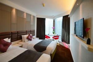 Televiisor ja/või meelelahutuskeskus majutusasutuses Stanford Hotel Hong Kong