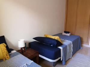 Łóżko lub łóżka w pokoju w obiekcie Casa Natal. Tú rincón acogedor en El Cotillo.