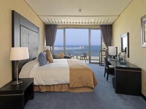 Giường trong phòng chung tại Atlas Essaouira Riad Resort