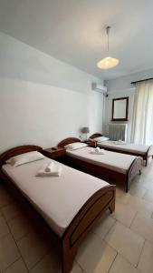 Postel nebo postele na pokoji v ubytování Balogiannis Hotel