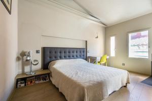 Кровать или кровати в номере La Loge de mer, Lodge urbain