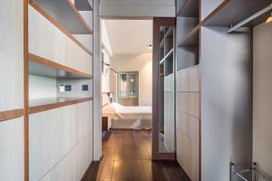 Кровать или кровати в номере La Loge de mer, Lodge urbain