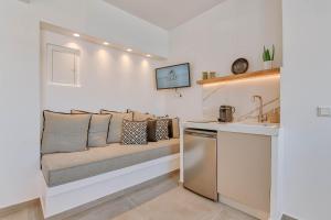 a couch sitting on a counter in a kitchen at Nautica Suites - Modern Seaview Suite in Antiparos +6 photos