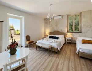 Posteľ alebo postele v izbe v ubytovaní B&B Donna Cinzia