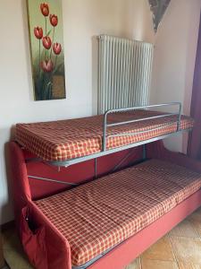 three empty bunk beds in a room at Casa Vacanza Il Malandrone in Vada +44 photos