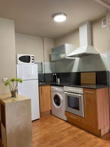 A kitchen or kitchenette at Apartamento Unquera - Val de San Vicente