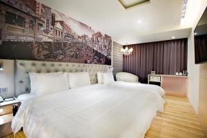Postel nebo postele na pokoji v ubytování FX Hotel Tainan + 37 fotografií