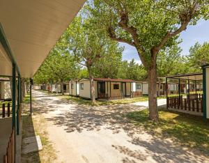 a row of mobile homes at a campground at Camping Classe in Lido di Dante