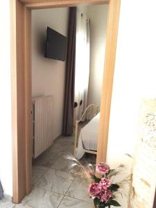 A television and/or entertainment centre at B&B Lo Scrigno del Salento