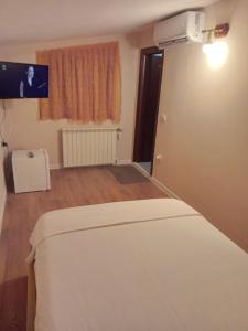 Letto o letti in una camera di Drini Hotel