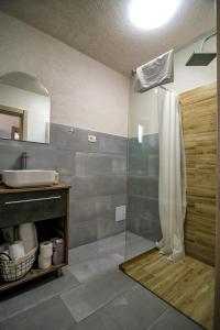 a bathroom with a shower and a sink at Casa AdiMan in Vama Veche +136 photos