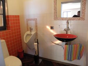 a bathroom with a sink and a toilet and a urinal at Skalny Dom in Stronie Śląskie