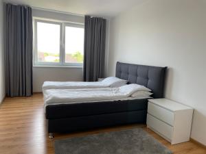 Ένα ή περισσότερα κρεβάτια σε δωμάτιο στο Palanga Apartment Daukanto 17