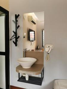 a bathroom with a bowl sink on a counter at Cheras-Miharja Homestay @Sunway Velocity in Kuala Lumpur