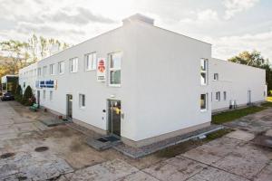 a white building with the front of it at Hostel Rakieta in Gdańsk