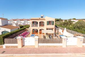 a large house with a fence in front of it at Villa Matias Maria by Villa Plus in Cala en Blanes