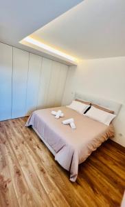 Postel nebo postele na pokoji v ubytování Loft City Center Viana