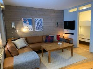 a living room with a couch and a coffee table at Åre Travel - Center in Åre