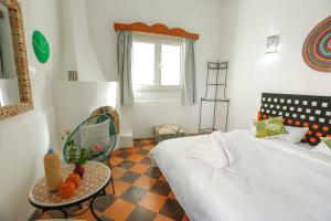 Postel nebo postele na pokoji v ubytování Luxury Riad Mounia