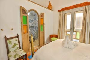 Postel nebo postele na pokoji v ubytování Luxury Riad Mounia