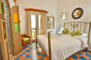 Postel nebo postele na pokoji v ubytování Luxury Riad Mounia