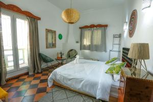 Postel nebo postele na pokoji v ubytování Luxury Riad Mounia