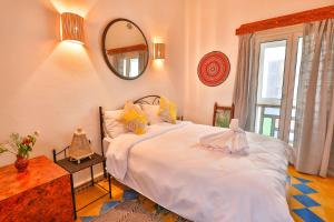 Postel nebo postele na pokoji v ubytování Luxury Riad Mounia