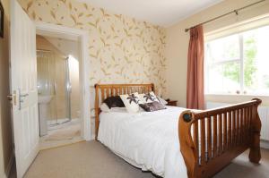 a bedroom with a large bed and a window at slieve rushen in Derrylin