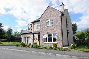 a brick house on the side of a street at slieve rushen in Derrylin