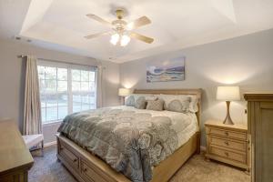 a bedroom with a bed and a ceiling fan at Pooler Travelers Retreat VI - Entire House - in Savannah