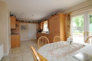 a kitchen and dining room with a table and chairs at slieve rushen in Derrylin