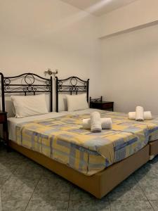 Ένα ή περισσότερα κρεβάτια σε δωμάτιο στο Ioanna Apartments