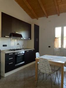 Kuchyň nebo kuchyňský kout v ubytování Archi di sole - Appartamenti