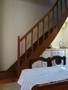 a bed in a room with a stair case at The Garden in Chios